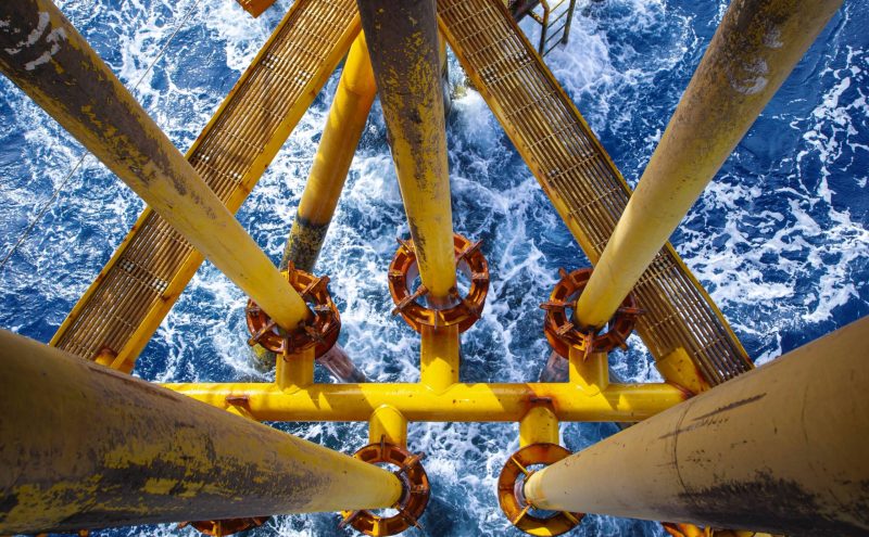 Offshore drill yellow oil and gas wave sea production petroleum pipeline.