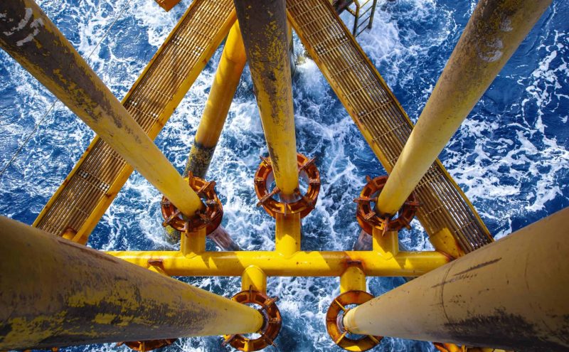 Offshore drill yellow oil and gas wave sea production petroleum pipeline.